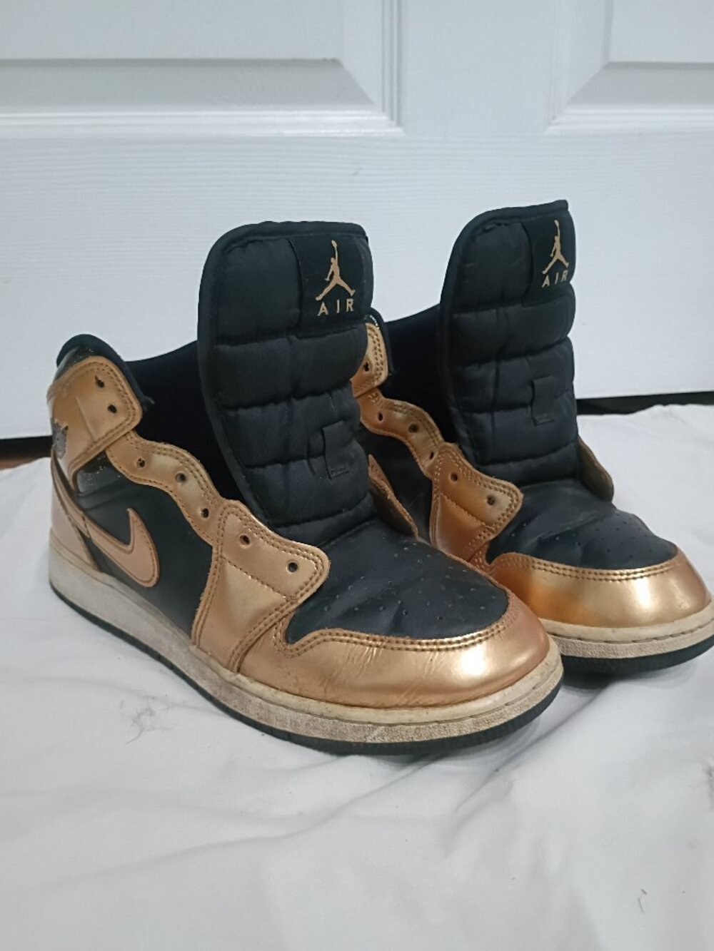 Jordan Black and Gold High-Top Sneakers size 7
